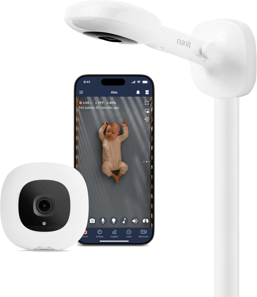 A baby monitor setup featuring a camera mounted on a flexible arm and a smartphone displaying a live feed of a sleeping baby.